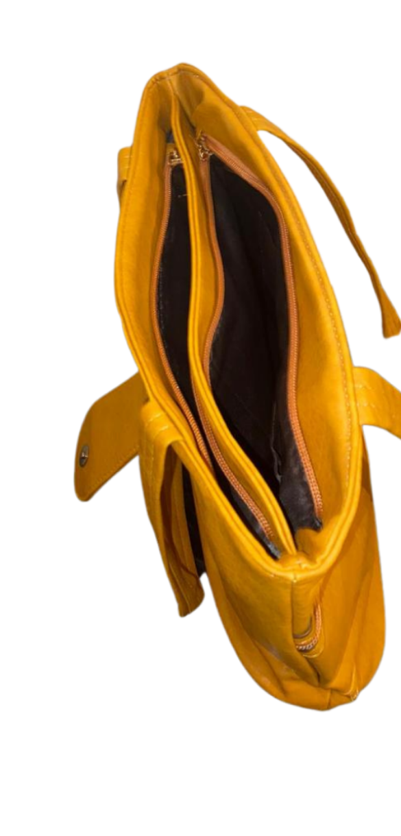 Tan Handbag with bow detail and double zips across the front.
