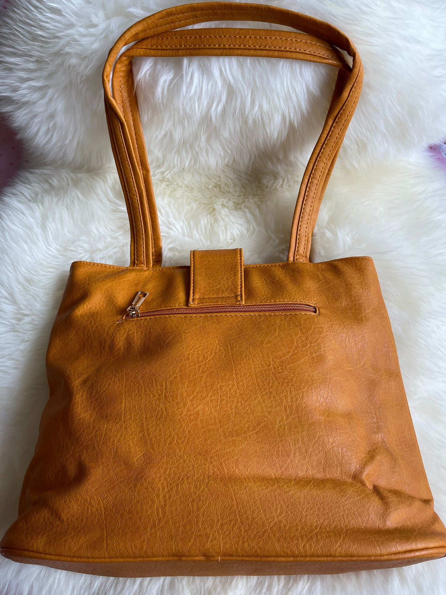 Tan Handbag with bow detail and double zips across the front.